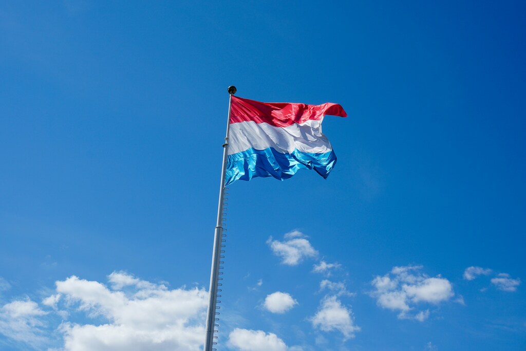 Luxembourg flag against a blue sky